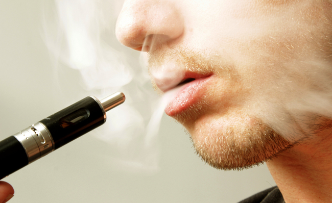 closeup of man smoking vape symbolic of intuitsolutions as Ecommerce Vape Experts