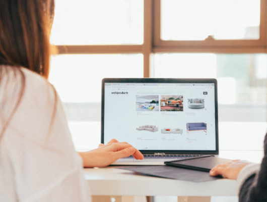 women looking at laptop with ecommerce shop