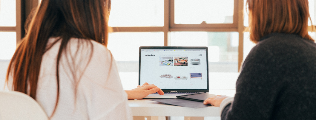 women looking at laptop with ecommerce shop