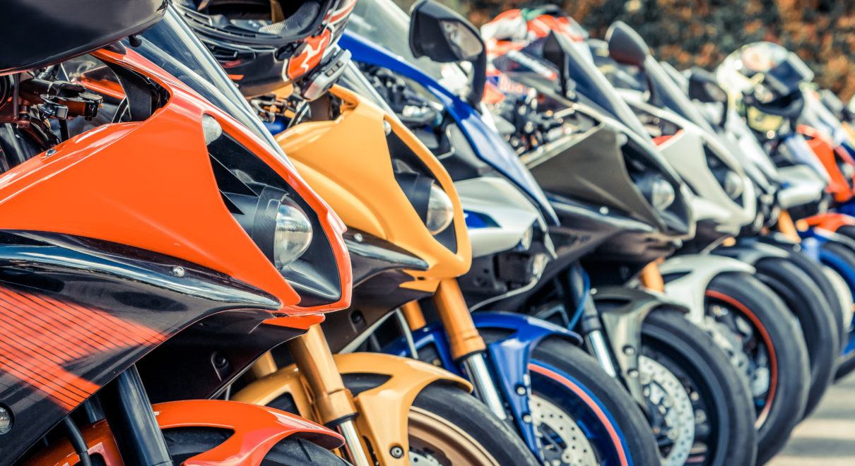 Motorcycles group parking on city street during adventure journey. Motorcyclists community travel concept.