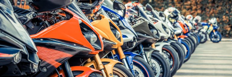 Motorcycles group parking on city street during adventure journey. Motorcyclists community travel concept.