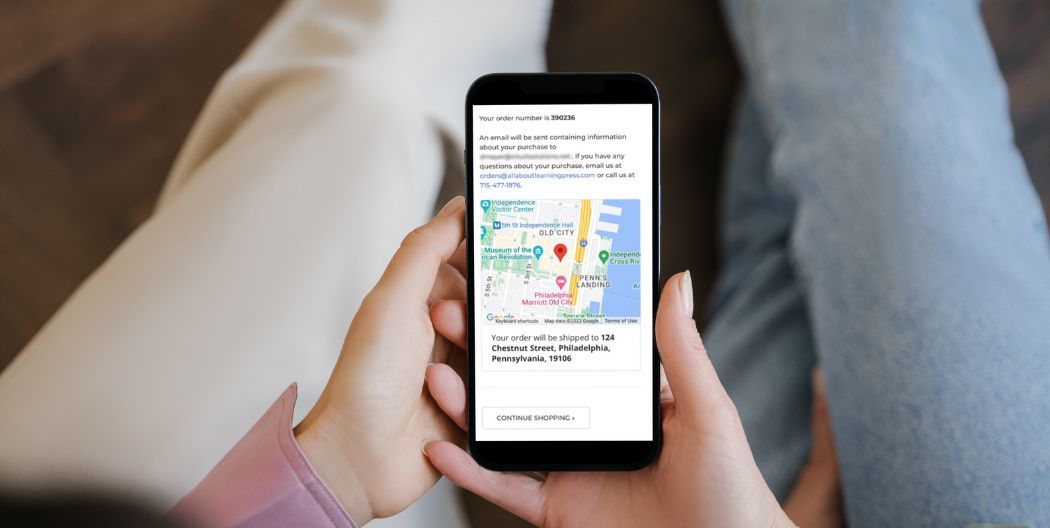 Women holding phone showing Google map on order confirmation page