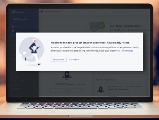 laptop on table with popup banner about upgrading to BigCommerce Products v3