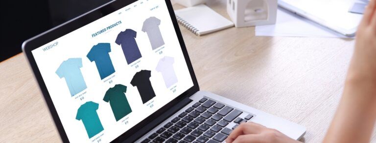 persona on laptop browsing tshirts in online shop