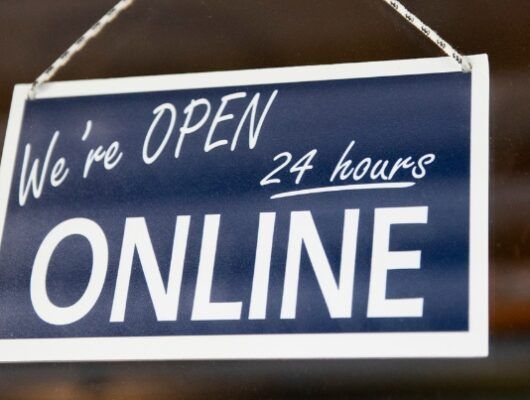 Sign reading "We're Open 24 Hours Online"