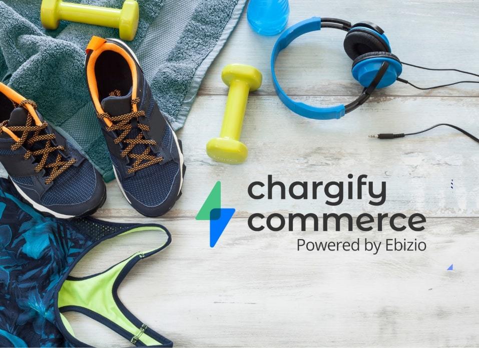 Chargify Commerce Logo next to sports apparel and equipment on light gray wooden background
