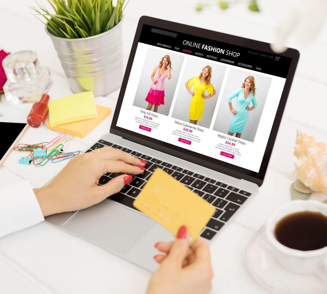 browsing online fashion shop website with credit card ready to purchase