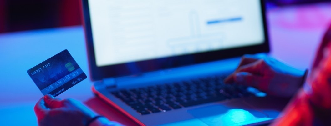 Person using credit card to check out online