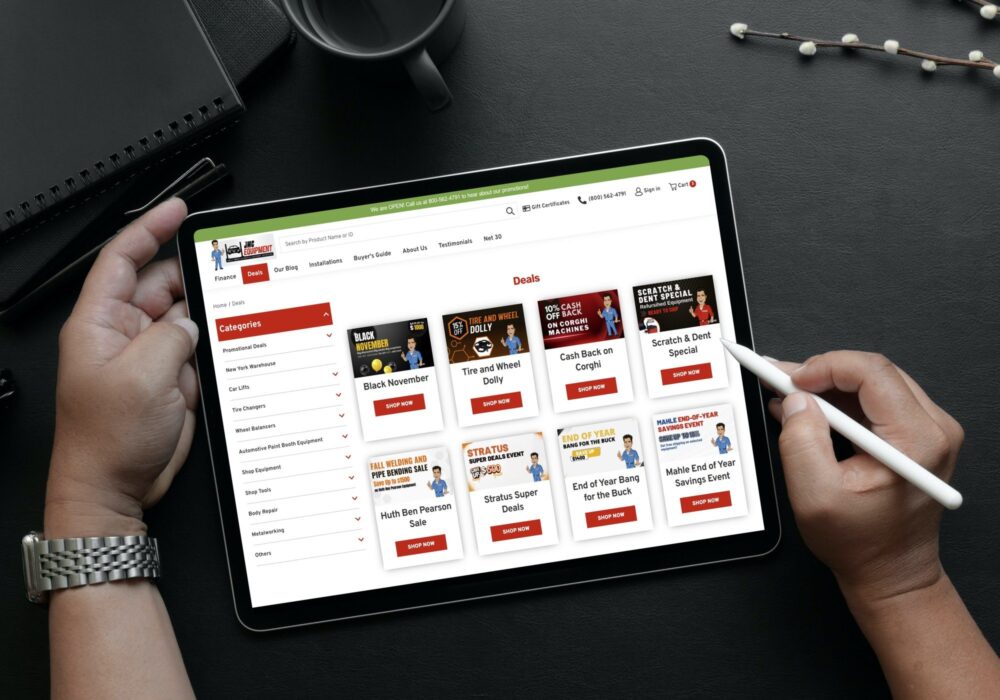 Person on tablet browsing 'Deals' page on JMCAutomotiveEquipment.com