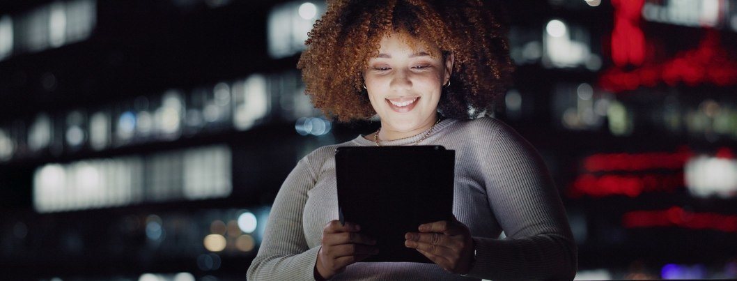 Tablet, night balcony and relaxed woman reading and smiling, customer experience or ecommerce