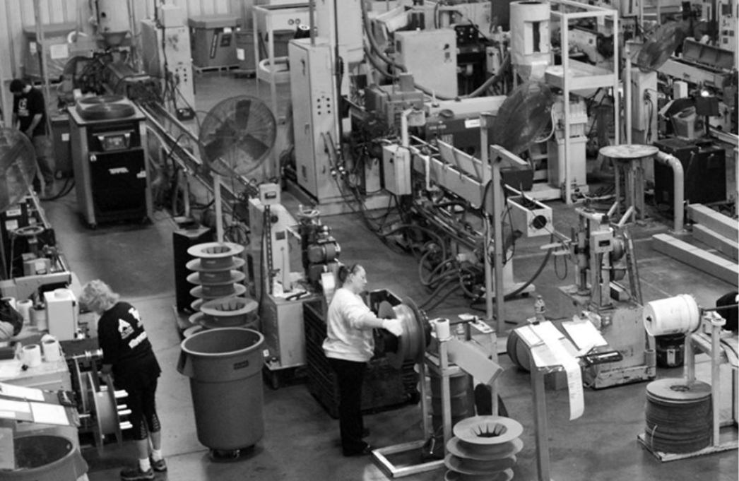 People working in in-house manufacturing facility at Action Industries